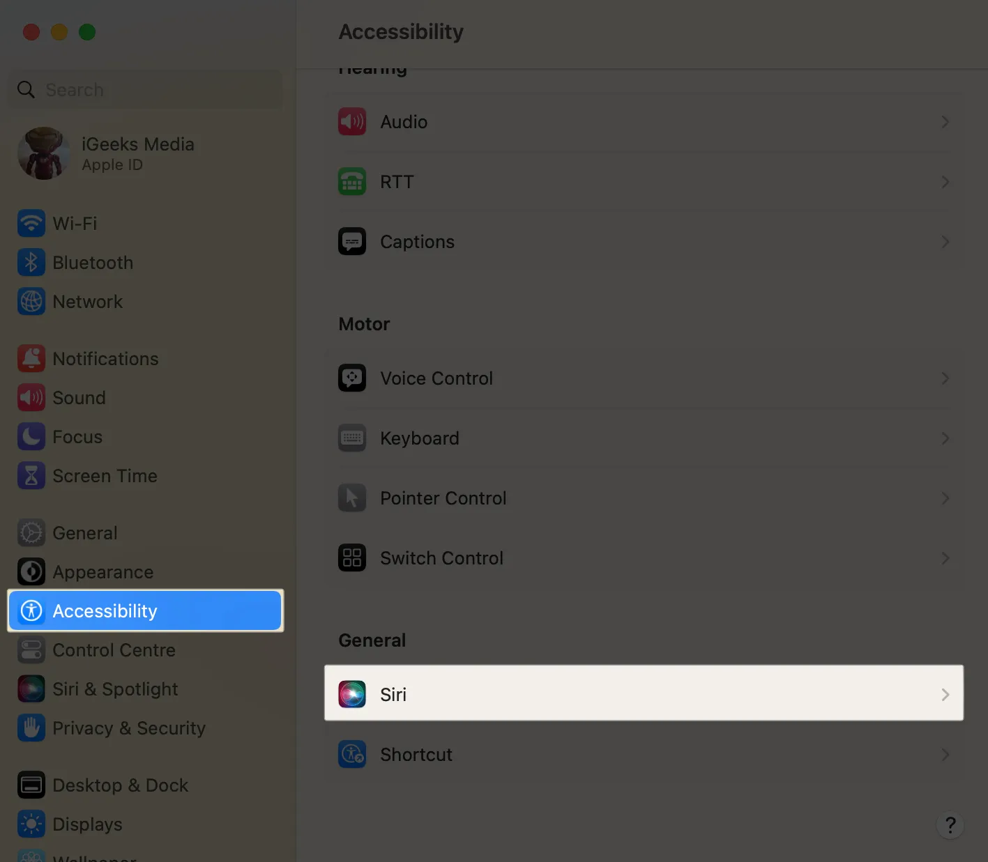 Abra Configurações do sistema, Acessibilidade e clique em Siri.