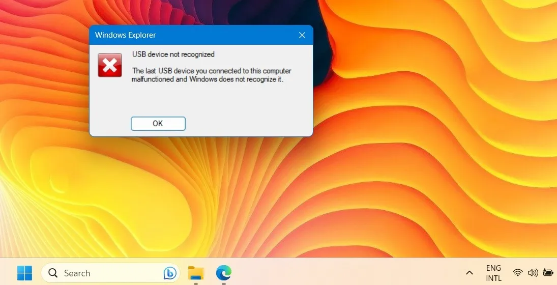 Se muestra un error de dispositivo USB no reconocido en la pantalla del escritorio de Windows.