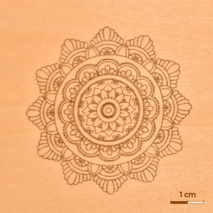 Gravura em madeira mostrando uma mandala detalhada.