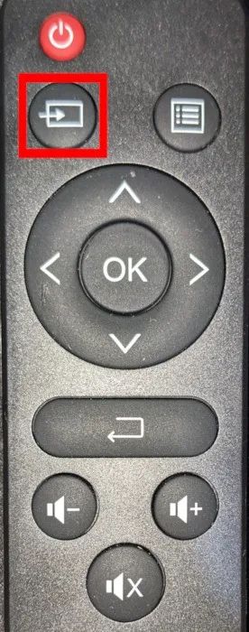 顯示簡單投影機遙控器上的輸入選擇按鈕的照片。