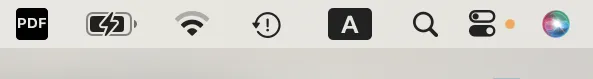 Point orange dans la barre de menus macOS