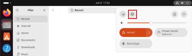 Zrzut ekranu przedstawiający ikonę koła zębatego na pasku zadań systemu Ubuntu.