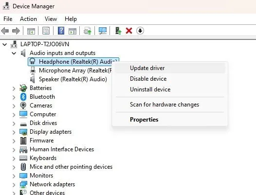 Updating a driver to fix headphones not working in Windows.