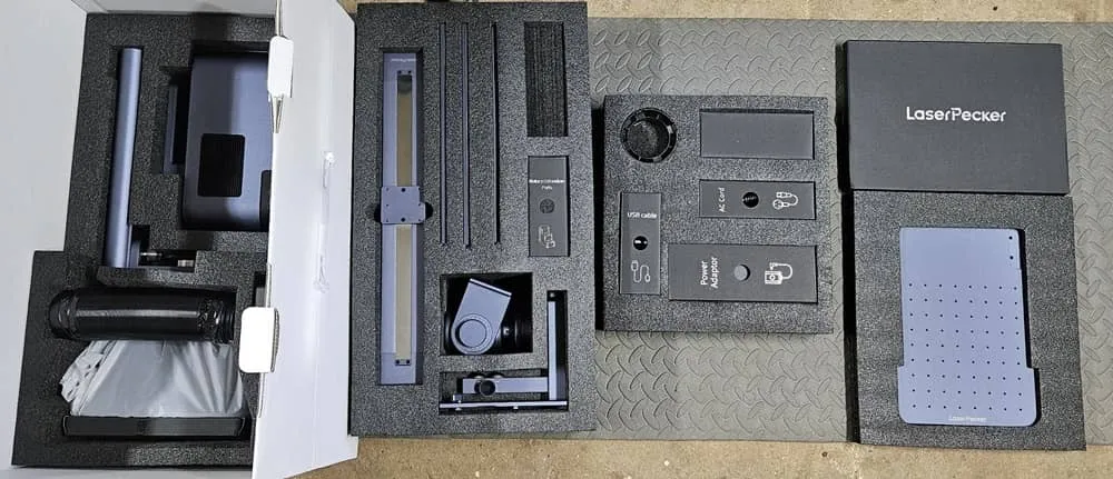 LaserPecker parts in packaging.