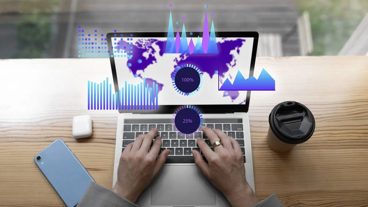 hands on laptop with performance metrics icons