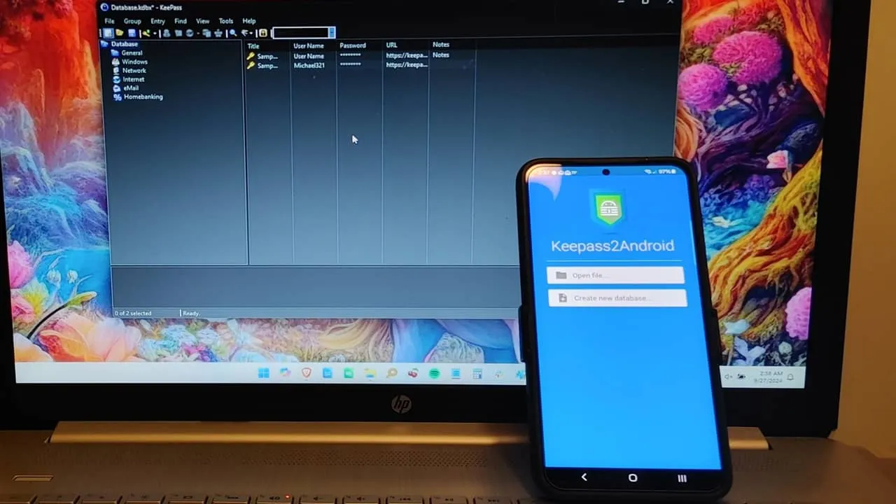 Keepass2Android on a phone sitting on a laptop with Keepass open.