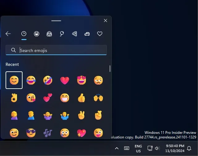 Windows 11 emoji panel button on the taskbar